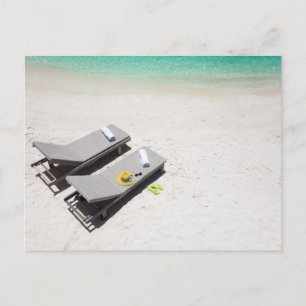Lounge chairs on a beach postcard