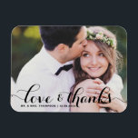 Love and Thanks | Black Calligraphy Photo Wedding Magnet<br><div class="desc">Celebrate your love and show gratitude with our customisable photo wedding thank you magnet! This unique keepsake is perfect for reminding your loved ones of your special day while expressing your heartfelt thanks in a memorable way. It features a modern typography photo overlay. Personalise by adding your photo and details....</div>