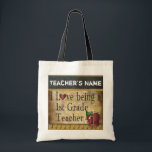Love Being a 1st Grade Teacher | DIY Name Tote Bag<br><div class="desc">A unique rustic styled Tote Bag for a first grade teacher ready for you to personalise. ✔Note: Not all template areas need changed. 📌If you need further customisation, please click the "Click to Customise further" or "Customise or Edit Design"button and use our design tool to resize, rotate, change text colour,...</div>