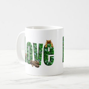 Love in Every Purr: Kittens Playing on Word Love Coffee Mug