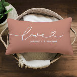 Love in Heart Script Muted Clay Custom Monogram Lumbar Cushion<br><div class="desc">Modern and stylish custom lumbar throw pillow design features a simple and minimal "Love" typography design that includes flourish and heart details. Personalise the uppercase text below with a monogram for a couple or family, a quote, or other preferred text. The muted clay orange and white colours can be modified....</div>
