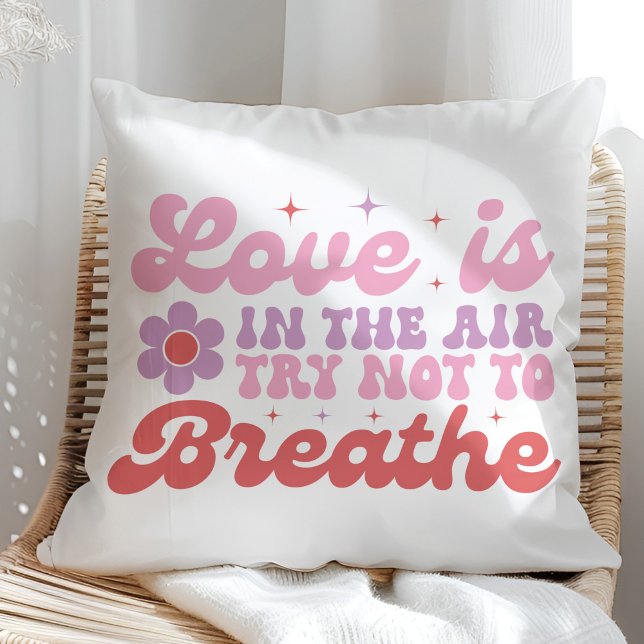 Love is in the Air Funny Anti Valentine  Cushion (Love is in the Air Funny Anti Valentine Throw Pillow on a sunny rattan chair.)