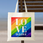 Love Is love Pride Tote Bag<br><div class="desc">This Pride Tote Bag is decorated with LOVE IS LOVE in bold white letters on a watercolor rainbow background of red,  orange,  yellow,  green,  blue,  and purple.
Original Watercolor © Michele Davies.</div>