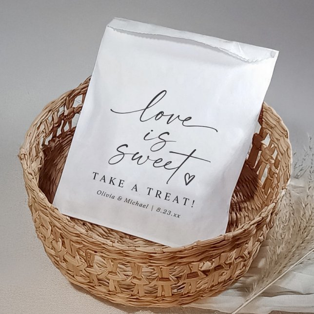 Love is Sweet Black and White Script Wedding Favour Bag (Modern black and white wedding favor bag with “Love Is Sweet” script and heart design)