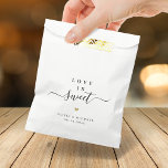 Love is sweet simple elegant script wedding favour bag<br><div class="desc">Modern minimalist script "love is sweet" with colour editable heart shape and couple's names and event date,  simple and elegant. Great favour bags for modern wedding or other events. 
See all the matching pieces in collection.</div>