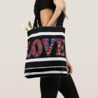 Love tote bag with black and white strips.