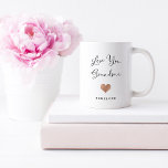 Love You Grandma | Handwritten Script and Heart Coffee Mug<br><div class="desc">This simple and stylish mug says "Love you Grandma" in trendy,  handwritten black script with a faux rose gold look heart and a spot for her grandchild's name.</div>