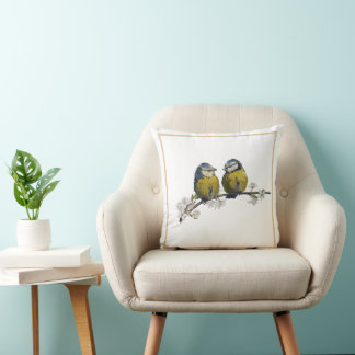 Lovebirds sitting on a cherry blossom branch cushion
