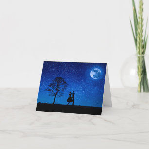 Lovers under a full moon card