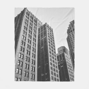 LOW ANGLE GRAYSCALE PHOTOGRAPHY OF HIGH-RISE BUILD FLEECE BLANKET