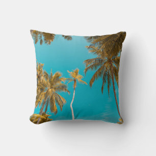 Low-angle photo of coconut trees cushion