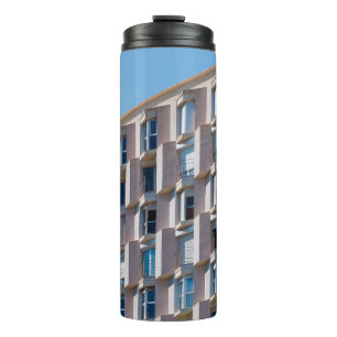 LOW ANGLE PHOTO OF GRAY CONCRETE BUILDING THERMAL TUMBLER