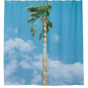 Low-angle photo of palm trees under blue sky shower curtain