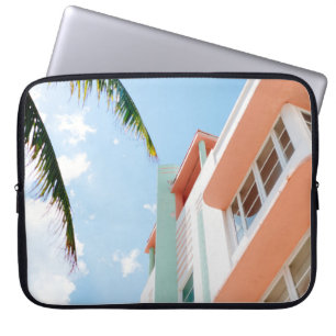 Low angle photo of white and orange concrete build laptop sleeve
