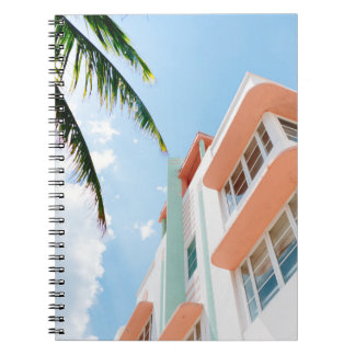 LOW ANGLE PHOTO OF WHITE AND ORANGE CONCRETE BUILD NOTEBOOK
