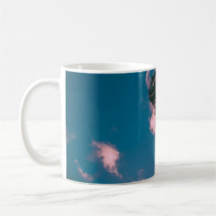 Low-angle photograph of palm trees coffee mug