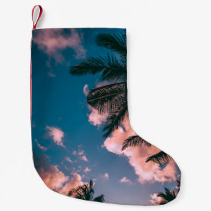 Low-angle photograph of palm trees small christmas stocking