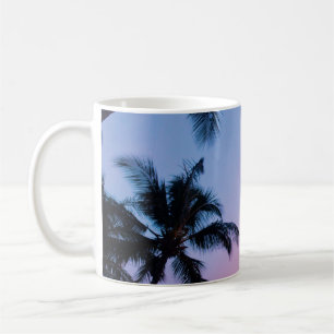 Low-angle photography coconut trees during golden coffee mug