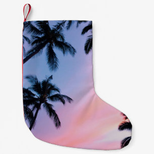Low-angle photography coconut trees during golden small christmas stocking