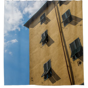 LOW ANGLE PHOTOGRAPHY OF BROWN LOUVER WINDOW SHOWER CURTAIN