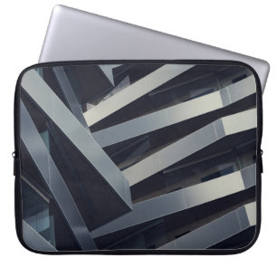 LOW ANGLE PHOTOGRAPHY OF GRAY BUILDING AT DAYTIME LAPTOP SLEEVE
