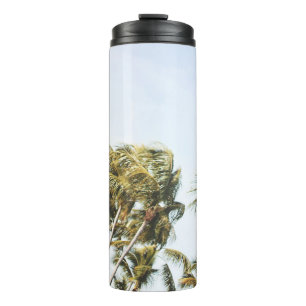 LOW-ANGLE PHOTOGRAPHY OF GREEN COCONUT TREES UNDER THERMAL TUMBLER