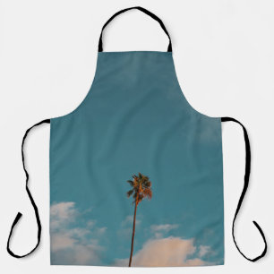 Low angle photography of palm tree under blue sky apron