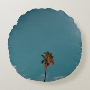 Low angle photography of palm tree under blue sky round cushion