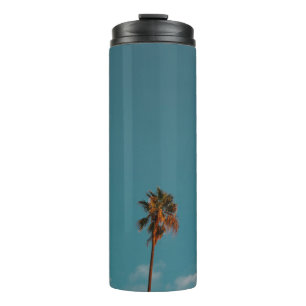 Low angle photography of palm tree under blue sky thermal tumbler