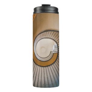 Low angle photography of spiral ladder thermal tumbler