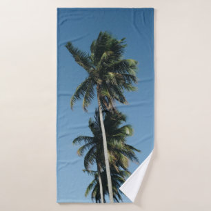 Low angle photography of three coconut trees bath towel