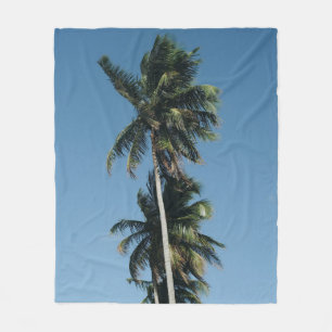 Low angle photography of three coconut trees fleece blanket