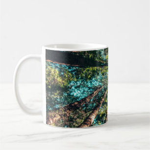 Low angle photography of trees at daytime coffee mug