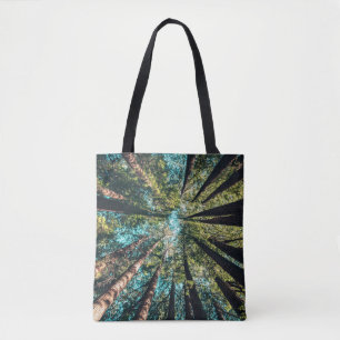 Low angle photography of trees at daytime tote bag