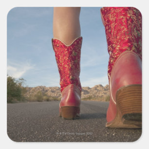 Low-angle view of woman wearing cowboy boots square sticker