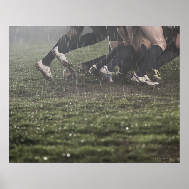 Lower section of rugby player in scrum, pushing poster (Front)