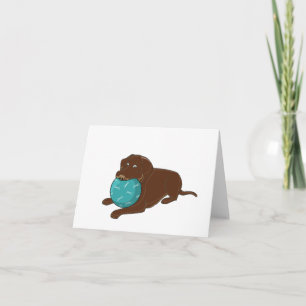 LR chocolate lab chewing ball cartoon Card
