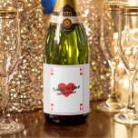 Lucky In Love Playing Card Couples Shower Favour Sparkling Wine Label<br><div class="desc">Elevate your couples shower with our custom 'Lucky In Love' bottle labels! Embrace the whimsy of a playing card-inspired design, adorned with iconic heart King and Queen symbols, all rendered in bold red, white, and black hues. Make a statement with personalised text, prominently featuring the endearing phrase 'Lucky In Love'...</div>
