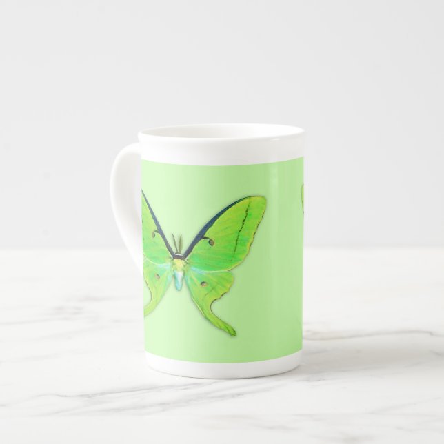 Luna moth on a pale green background bone china mug (Front Left)