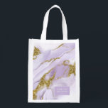 Lux Ink Lavender Abstract Wedding Party ID990 Reusable Grocery Bag<br><div class="desc">This custom design featuring an alcohol ink abstract in shades from soft lavender to lilac purple with glittering gold accents, is perfect for a romantic and elegant wedding theme. The coordinating shopping bag design shown here, provides a template to easily add your wedding party member, name and wedding date. Search...</div>