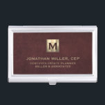 Luxury Gold Initial Logo Oxblood Leather Business Card Holder<br><div class="desc">Simple modern luxury design with brushed metallic gold initial logo medallion with personalised name,  title,  company name or custom text below in classic block typography on a oxblood red leather textured background. Personalise for your custom use.</div>