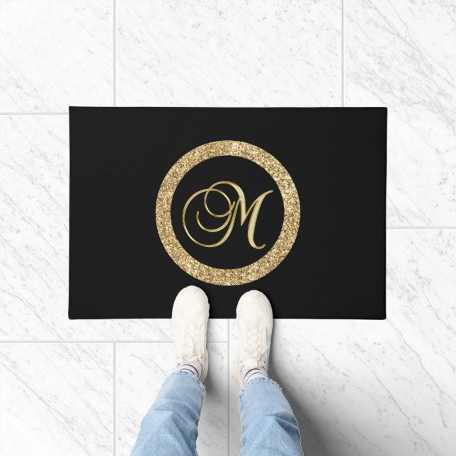 M gold monogram on black doormat (Indoor)