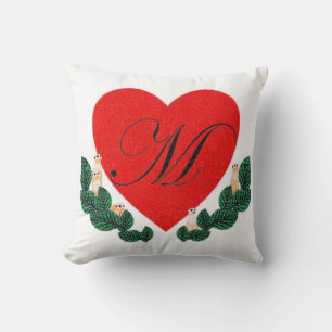 M in a heart cushion