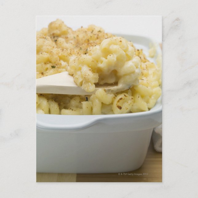 Macaroni cheese in baking dish with wooden postcard (Front)