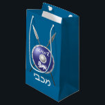 Maccabee Shield And Spears Small Gift Bag<br><div class="desc">For your Chanukkah party. A depiction of a Maccabee's shield and two spears. The shield is adorned by a lion and text reading "Yisrael" (Israel) in the Paleo-Hebrew alphabet. "Maccabee" also appears in modern Hebrew. The Maccabees were Jewish rebels who freed Judea from the yoke of the Seleucid Empire. Chanukkah...</div>