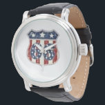 Made In America Vintage Shield Heritage Leather Watch<br><div class="desc">Carry a piece of history on your wrist with this "MADE IN AMERICA" heritage watch. Featuring an exquisitely detailed vintage shield adorned with the classic stars and stripes, this timepiece captures the rugged elegance of mid-century Americana. The weathered red, white, and blue graphics stand out with sophisticated clarity against the...</div>