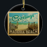 Madeira Beach Vintage Travel Ceramic Ornament<br><div class="desc">This Greetings From Madeira Beach vintage postcard design features a sandy beach with a beautiful turquoise ocean water and above the sea,  a blue sky with billowy white clouds. In vintage travels style.</div>