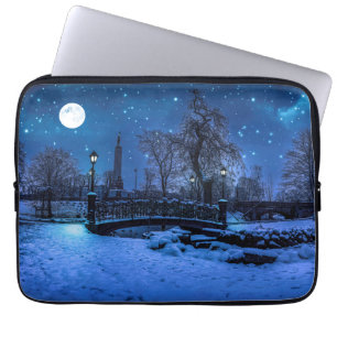 Magic winter night with starry sky and full moon laptop sleeve
