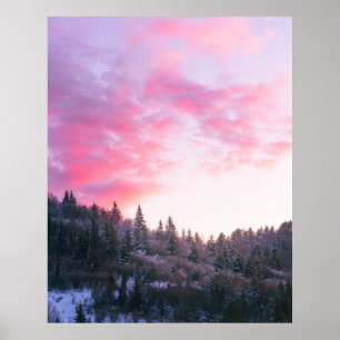 Magical bright pink sunset above snowy forest poster