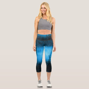Magical fog in snowy spruce forest capri leggings